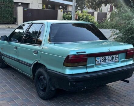 Синий Мицубиси Лансер, объемом двигателя 1.5 л и пробегом 300 тыс. км за 599 $, фото 9 на Automoto.ua