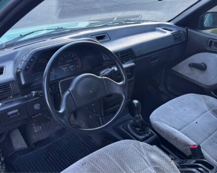 Синий Мицубиси Лансер, объемом двигателя 1.5 л и пробегом 300 тыс. км за 599 $, фото 11 на Automoto.ua