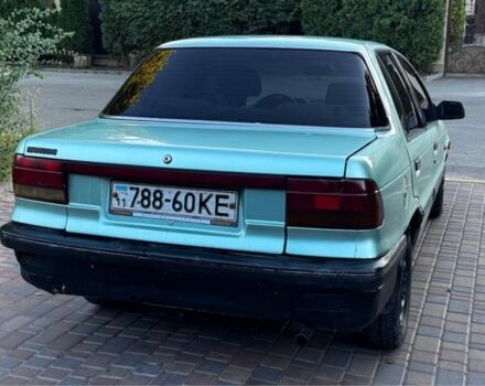 Синий Мицубиси Лансер, объемом двигателя 1.5 л и пробегом 300 тыс. км за 599 $, фото 5 на Automoto.ua