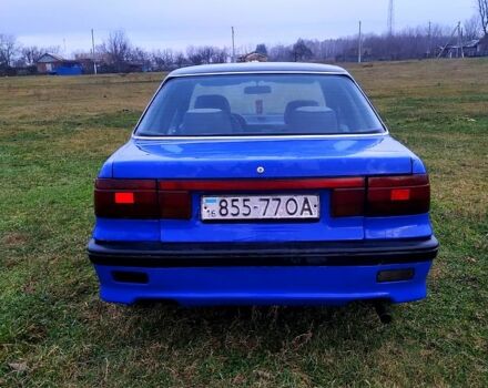 Синий Мицубиси Лансер, объемом двигателя 20 л и пробегом 380 тыс. км за 800 $, фото 2 на Automoto.ua