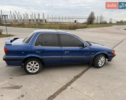 Синий Мицубиси Лансер, объемом двигателя 1.8 л и пробегом 245 тыс. км за 3000 $, фото 5 на Automoto.ua