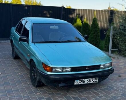Синий Мицубиси Лансер, объемом двигателя 1.5 л и пробегом 300 тыс. км за 599 $, фото 4 на Automoto.ua