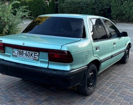 Синий Мицубиси Лансер, объемом двигателя 1.5 л и пробегом 300 тыс. км за 599 $, фото 2 на Automoto.ua