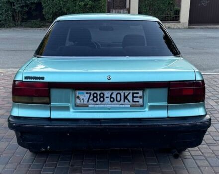 Синий Мицубиси Лансер, объемом двигателя 1.5 л и пробегом 300 тыс. км за 599 $, фото 6 на Automoto.ua