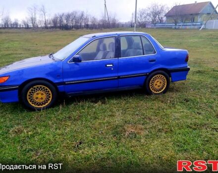 Синий Мицубиси Лансер, объемом двигателя 20 л и пробегом 380 тыс. км за 800 $, фото 1 на Automoto.ua