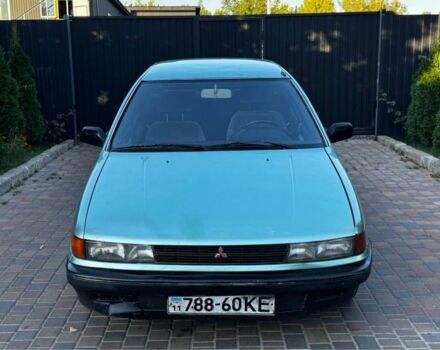 Синий Мицубиси Лансер, объемом двигателя 1.5 л и пробегом 300 тыс. км за 599 $, фото 1 на Automoto.ua