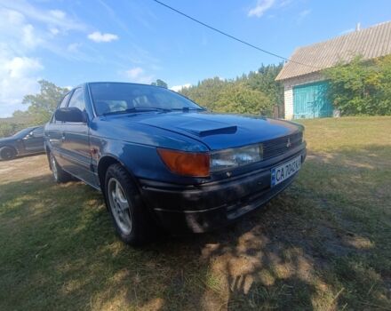 Синий Мицубиси Лансер, объемом двигателя 1.5 л и пробегом 450 тыс. км за 999 $, фото 1 на Automoto.ua