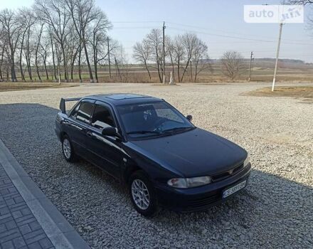 Синій Міцубісі Lancer, об'ємом двигуна 1.3 л та пробігом 380 тис. км за 1900 $, фото 6 на Automoto.ua