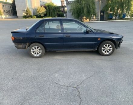 Синий Мицубиси Лансер, объемом двигателя 1.3 л и пробегом 250 тыс. км за 800 $, фото 7 на Automoto.ua