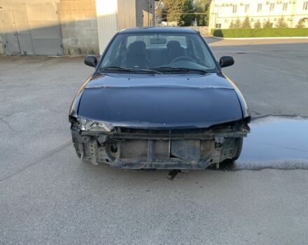 Синий Мицубиси Лансер, объемом двигателя 1.3 л и пробегом 250 тыс. км за 800 $, фото 1 на Automoto.ua