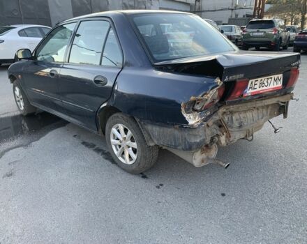 Синий Мицубиси Лансер, объемом двигателя 1.3 л и пробегом 250 тыс. км за 800 $, фото 4 на Automoto.ua