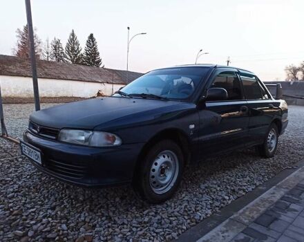 Синій Міцубісі Lancer, об'ємом двигуна 1.3 л та пробігом 380 тис. км за 1900 $, фото 7 на Automoto.ua