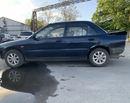 Синий Мицубиси Лансер, объемом двигателя 1.3 л и пробегом 250 тыс. км за 800 $, фото 3 на Automoto.ua