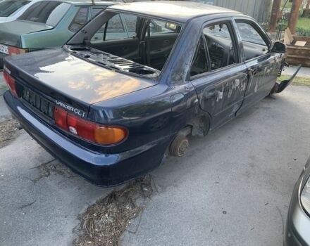 Синий Мицубиси Лансер, объемом двигателя 1.3 л и пробегом 250 тыс. км за 800 $, фото 10 на Automoto.ua