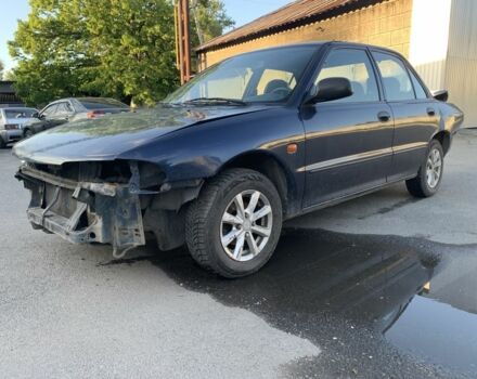 Синий Мицубиси Лансер, объемом двигателя 1.3 л и пробегом 250 тыс. км за 800 $, фото 2 на Automoto.ua