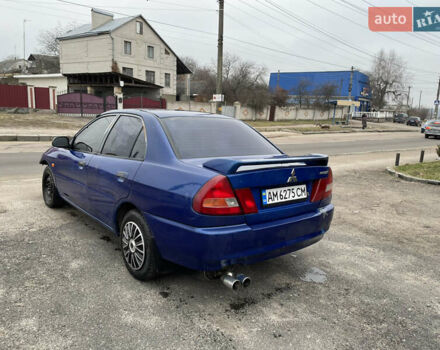 Синий Мицубиси Лансер, объемом двигателя 1.3 л и пробегом 250 тыс. км за 1000 $, фото 6 на Automoto.ua