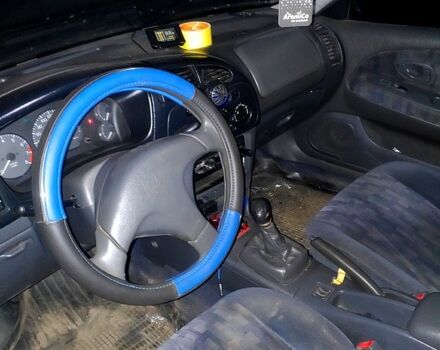 Синий Мицубиси Лансер, объемом двигателя 1.3 л и пробегом 270 тыс. км за 2100 $, фото 3 на Automoto.ua