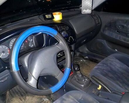 Синий Мицубиси Лансер, объемом двигателя 1.3 л и пробегом 270 тыс. км за 2100 $, фото 2 на Automoto.ua