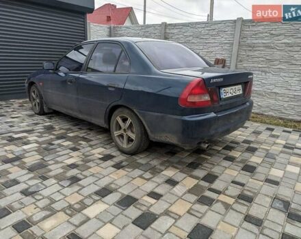 Синій Міцубісі Lancer, об'ємом двигуна 1.3 л та пробігом 250 тис. км за 2100 $, фото 1 на Automoto.ua