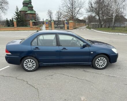 Синий Мицубиси Лансер, объемом двигателя 1.6 л и пробегом 182 тыс. км за 3500 $, фото 5 на Automoto.ua