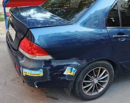 Синий Мицубиси Лансер, объемом двигателя 1.58 л и пробегом 411 тыс. км за 3000 $, фото 7 на Automoto.ua