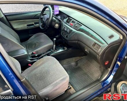 Синій Міцубісі Lancer, об'ємом двигуна 1.6 л та пробігом 220 тис. км за 3299 $, фото 9 на Automoto.ua