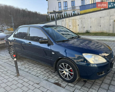 Синій Міцубісі Lancer, об'ємом двигуна 1.6 л та пробігом 400 тис. км за 2600 $, фото 7 на Automoto.ua