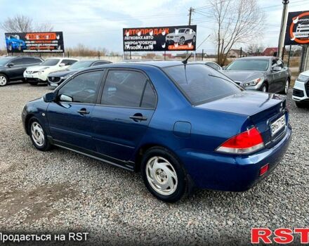 Синій Міцубісі Lancer, об'ємом двигуна 1.6 л та пробігом 220 тис. км за 3299 $, фото 3 на Automoto.ua