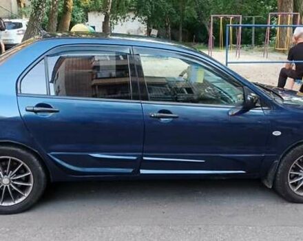 Синий Мицубиси Лансер, объемом двигателя 1.58 л и пробегом 411 тыс. км за 3000 $, фото 10 на Automoto.ua