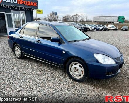 Синій Міцубісі Lancer, об'ємом двигуна 1.6 л та пробігом 220 тис. км за 3299 $, фото 5 на Automoto.ua