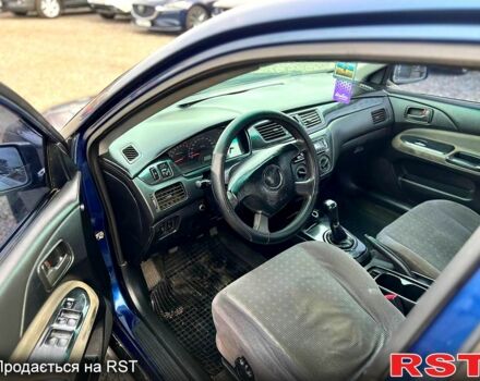 Синій Міцубісі Lancer, об'ємом двигуна 1.6 л та пробігом 220 тис. км за 3299 $, фото 6 на Automoto.ua