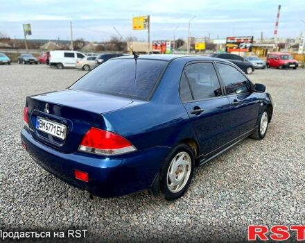Синій Міцубісі Lancer, об'ємом двигуна 1.6 л та пробігом 220 тис. км за 3299 $, фото 4 на Automoto.ua