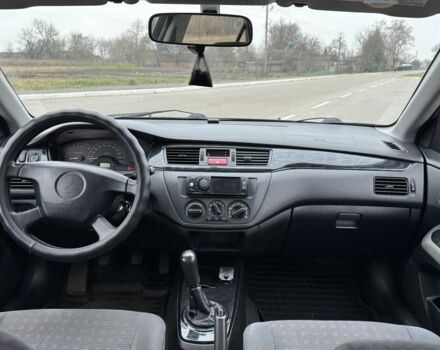 Синий Мицубиси Лансер, объемом двигателя 1.6 л и пробегом 182 тыс. км за 3500 $, фото 10 на Automoto.ua