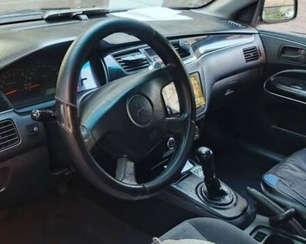 Синий Мицубиси Лансер, объемом двигателя 1.58 л и пробегом 411 тыс. км за 3000 $, фото 2 на Automoto.ua