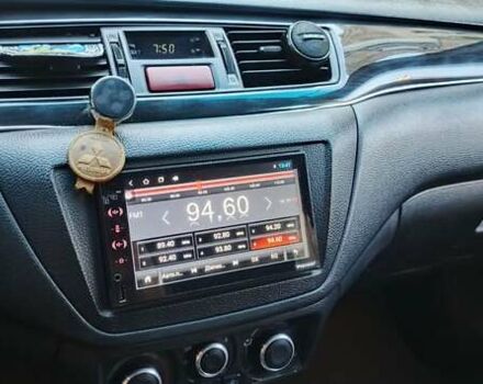 Синий Мицубиси Лансер, объемом двигателя 1.58 л и пробегом 411 тыс. км за 3000 $, фото 5 на Automoto.ua