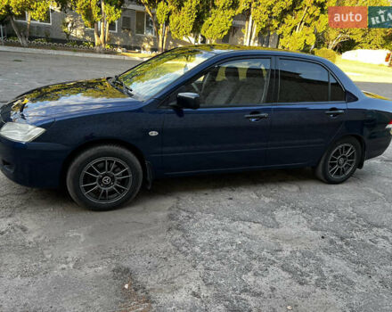Синій Міцубісі Lancer, об'ємом двигуна 1.58 л та пробігом 324 тис. км за 4150 $, фото 1 на Automoto.ua