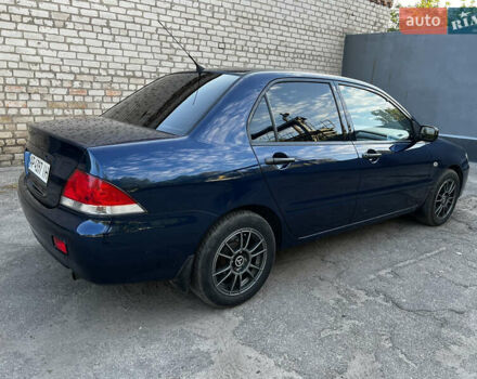 Синій Міцубісі Lancer, об'ємом двигуна 1.58 л та пробігом 324 тис. км за 4150 $, фото 6 на Automoto.ua
