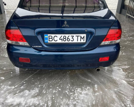 Синий Мицубиси Лансер, объемом двигателя 1.58 л и пробегом 234 тыс. км за 3500 $, фото 1 на Automoto.ua