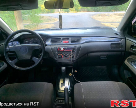 Синий Мицубиси Лансер, объемом двигателя 1.6 л и пробегом 295 тыс. км за 4550 $, фото 10 на Automoto.ua