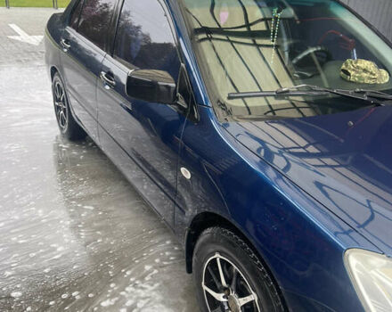 Синий Мицубиси Лансер, объемом двигателя 1.58 л и пробегом 234 тыс. км за 3500 $, фото 5 на Automoto.ua