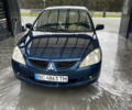Синий Мицубиси Лансер, объемом двигателя 1.58 л и пробегом 234 тыс. км за 3500 $, фото 1 на Automoto.ua