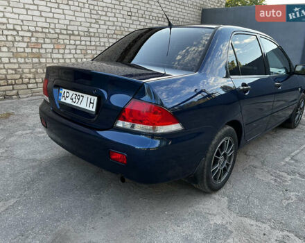 Синій Міцубісі Lancer, об'ємом двигуна 1.58 л та пробігом 324 тис. км за 4150 $, фото 5 на Automoto.ua