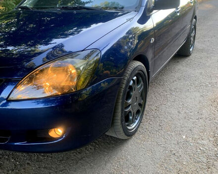 Синий Мицубиси Лансер, объемом двигателя 1.6 л и пробегом 295 тыс. км за 4550 $, фото 1 на Automoto.ua