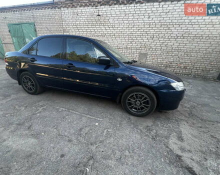 Синій Міцубісі Lancer, об'ємом двигуна 1.58 л та пробігом 324 тис. км за 4150 $, фото 7 на Automoto.ua