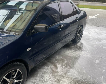 Синий Мицубиси Лансер, объемом двигателя 1.58 л и пробегом 234 тыс. км за 3500 $, фото 4 на Automoto.ua