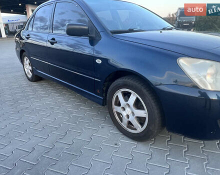 Синий Мицубиси Лансер, объемом двигателя 1.3 л и пробегом 290 тыс. км за 2999 $, фото 16 на Automoto.ua