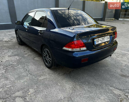 Синій Міцубісі Lancer, об'ємом двигуна 1.58 л та пробігом 324 тис. км за 4150 $, фото 3 на Automoto.ua