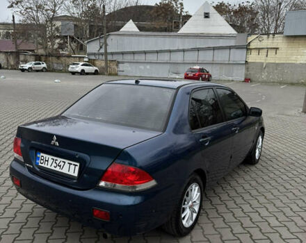 Синій Міцубісі Lancer, об'ємом двигуна 1.6 л та пробігом 200 тис. км за 5000 $, фото 5 на Automoto.ua