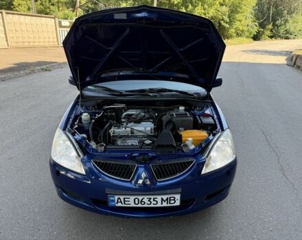 Синій Міцубісі Lancer, об'ємом двигуна 1.3 л та пробігом 198 тис. км за 3750 $, фото 14 на Automoto.ua