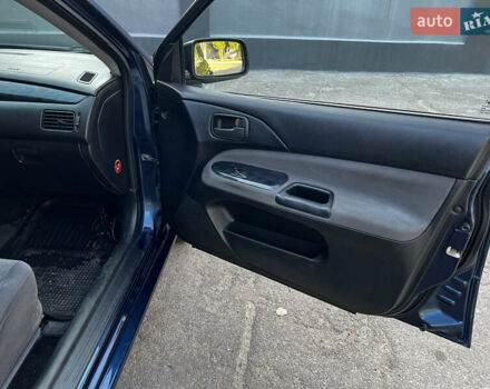 Синій Міцубісі Lancer, об'ємом двигуна 1.58 л та пробігом 324 тис. км за 4150 $, фото 18 на Automoto.ua